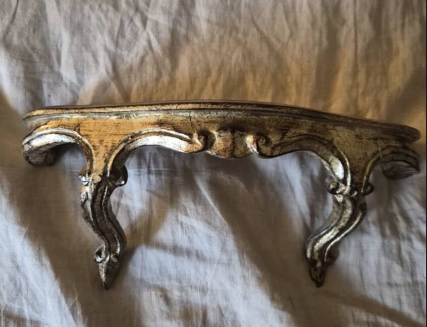 Golden wooden stool in the Louis XV style.