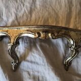 Golden wooden stool in the Louis XV style.