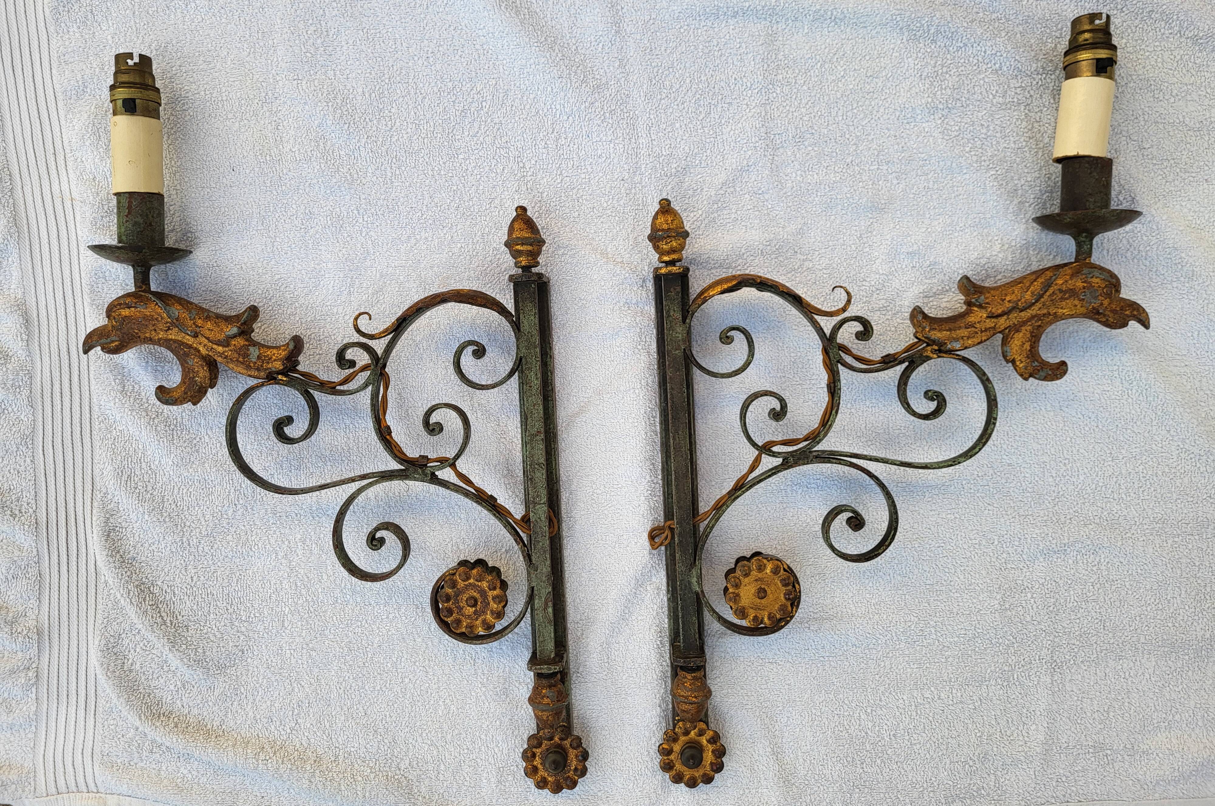 Pair of antique gilded wrought iron wall sconces with eagle heads