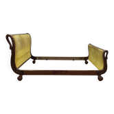 Mahogany lit empire from the early 19th century with swan necks and claw feet.