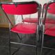 4 vintage folding chairs in red faux leather Plichaise, 1970s