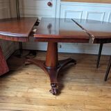 Round mahogany table with extensions