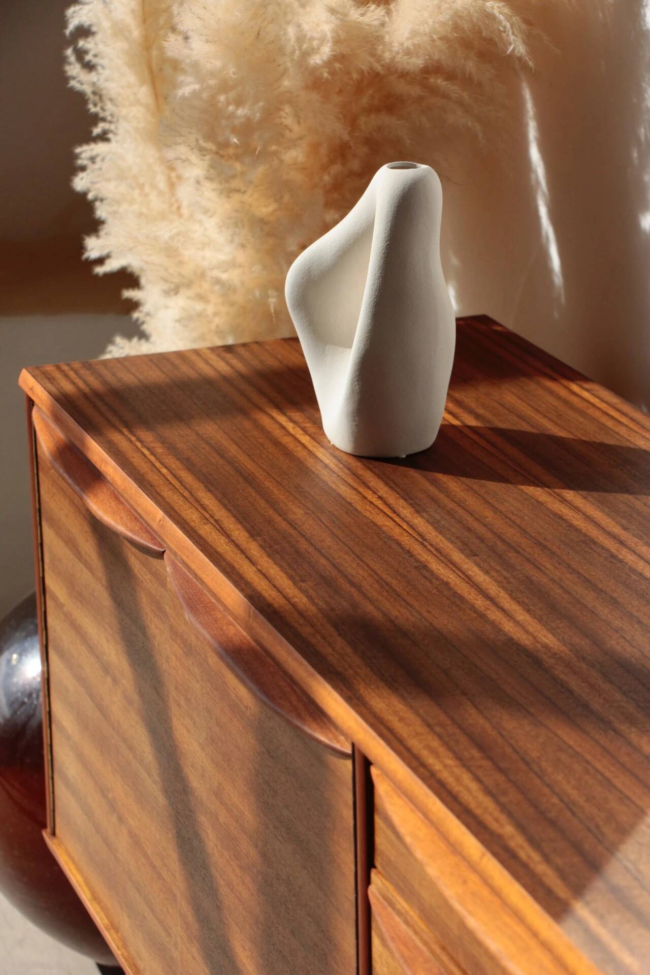 Vintage zebrano and walnut furniture from Morris of Glasgow.