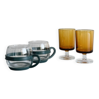 2 amber yellow stemmed glasses and 2 glass cups