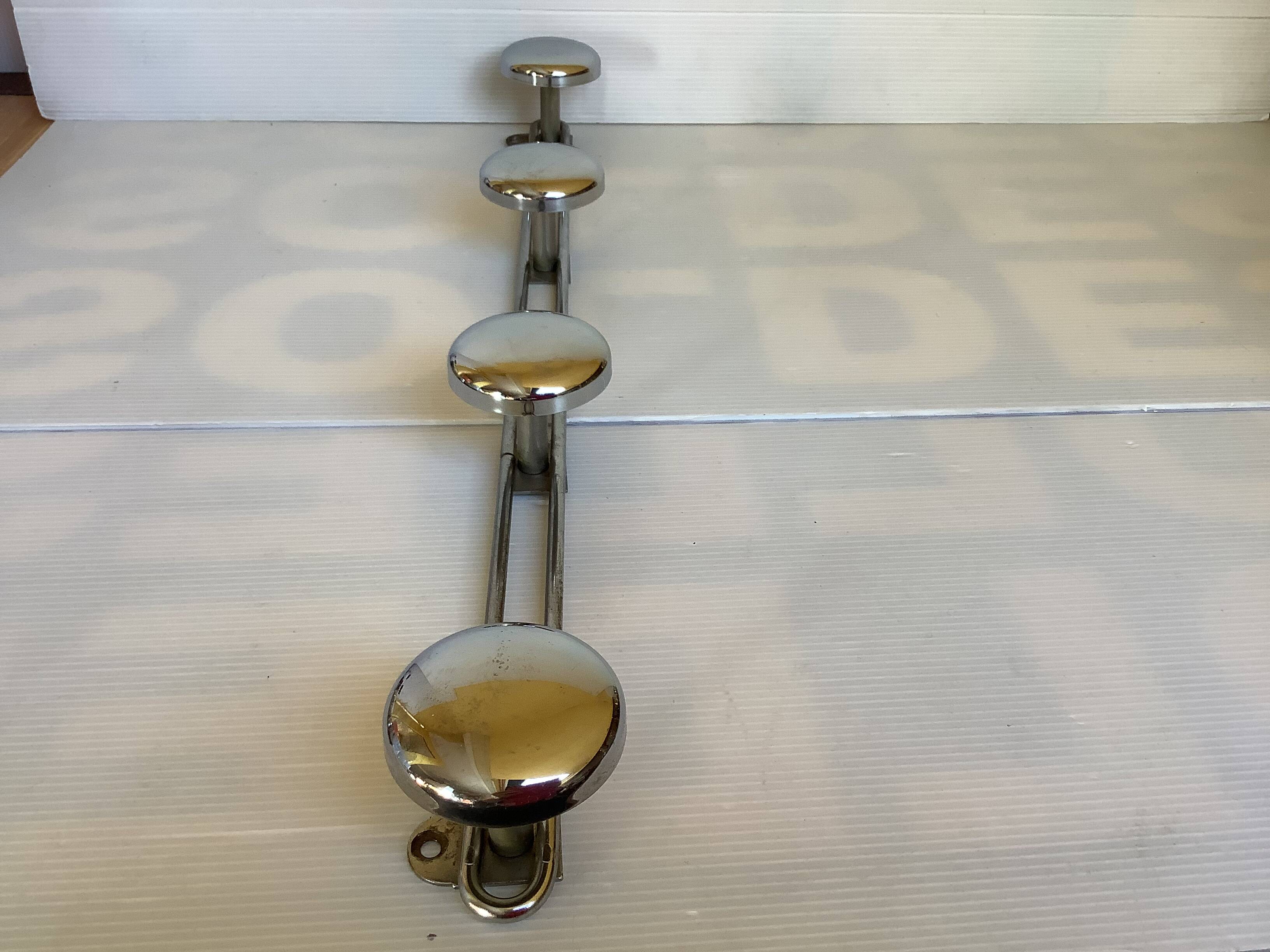 Chromed metal coat rack with four hooks