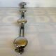 Chromed metal coat rack with four hooks