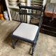 Black turned wooden chair and ivory cotton.