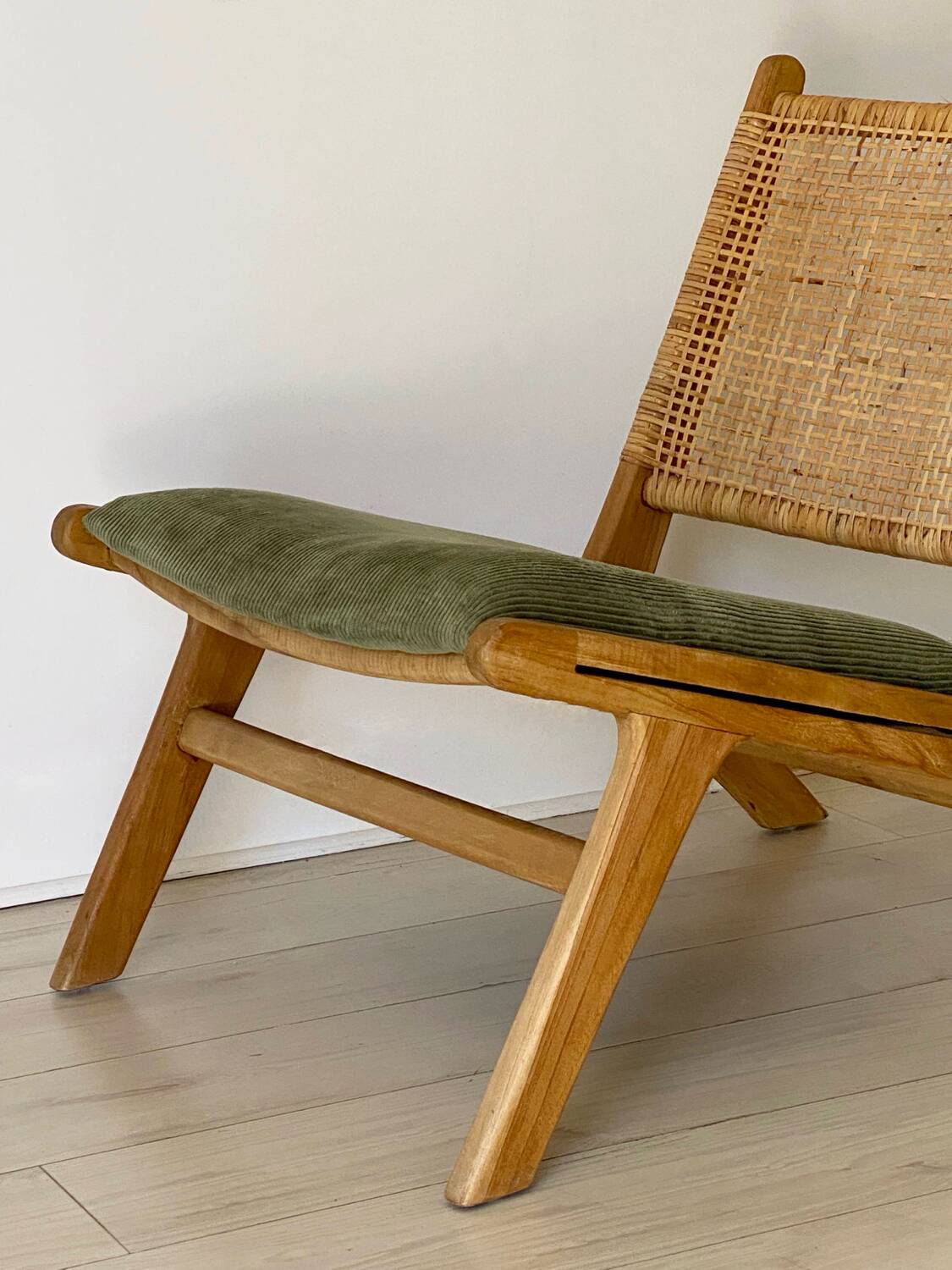 Wicker and corduroy armchair