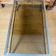 1970s coffee table in brushed metal, brass and smoked glass by Willy R