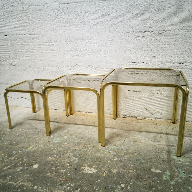 Trio of gilded metal trundle tables