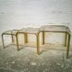 Trio of gilded metal trundle tables