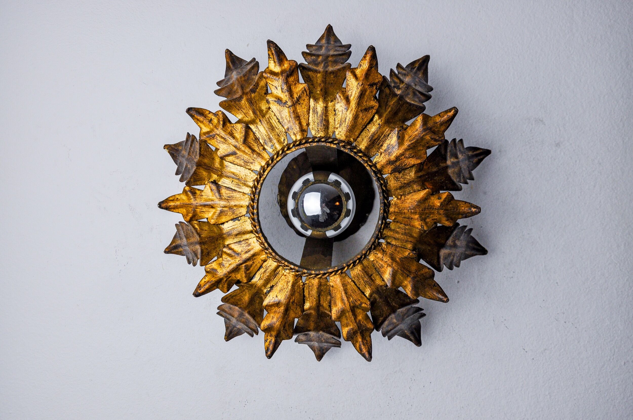 Sun wall lamp by ferro arte, metal and gold leaf, Spain, 1960