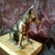 Greenhouse book dog sculpture regulates on marble slab