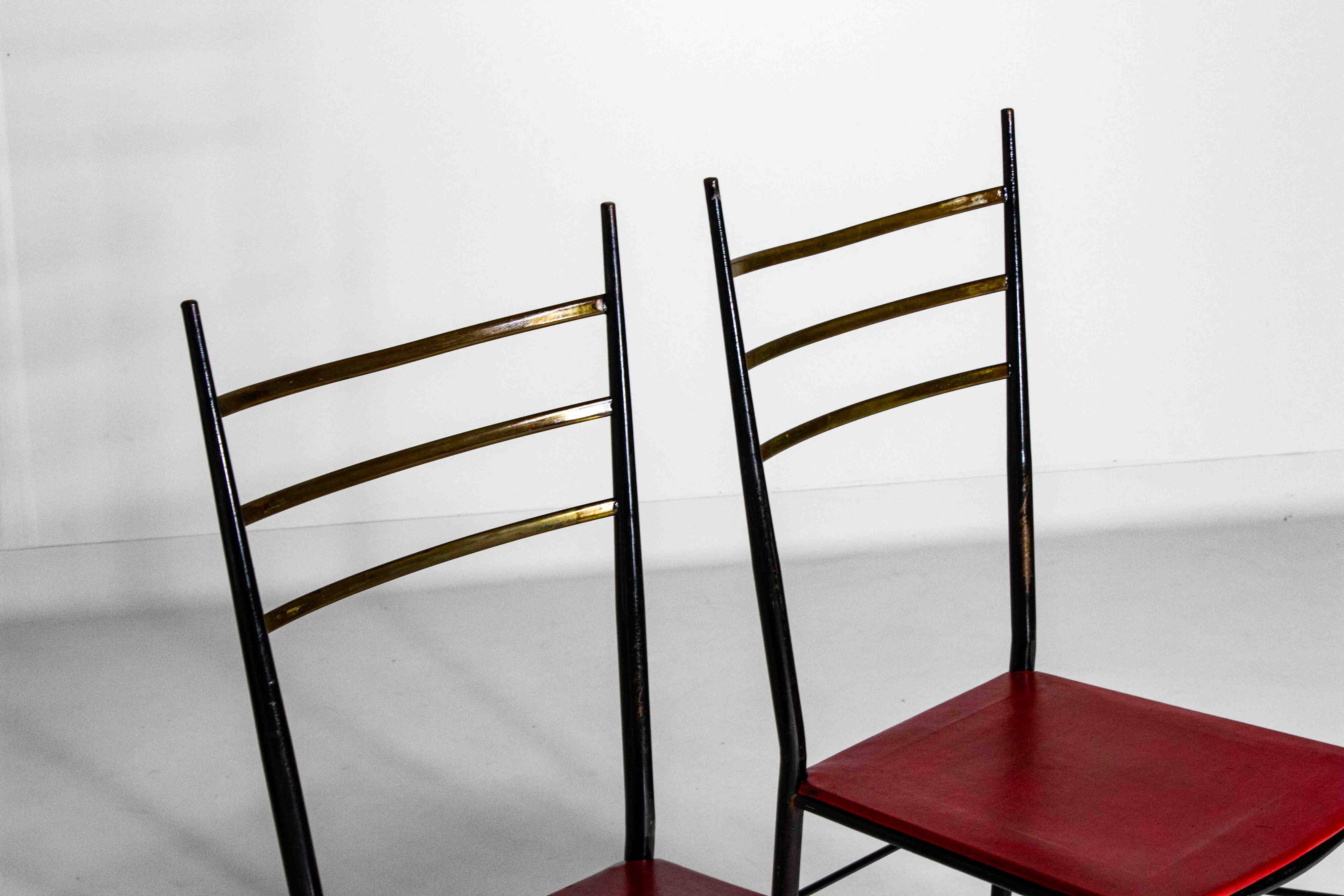 Fine set of metal dining chairs with red leather seating, Italy 1970s