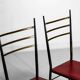 Fine set of metal dining chairs with red leather seating, Italy 1970s