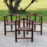 Set of three brutalist tripod armchairs in carved solid oak