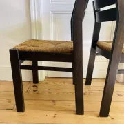Pair of straw-seated wooden chairs in the regain style.