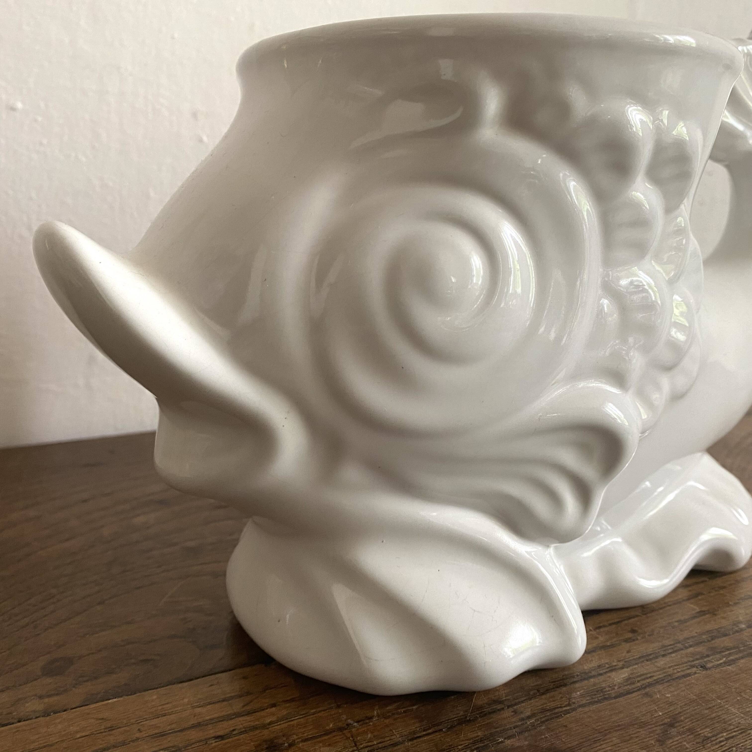 Zoomorphic fish pot cover in slip