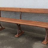 Old wooden bench with cast iron base