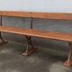 Old wooden bench with cast iron base