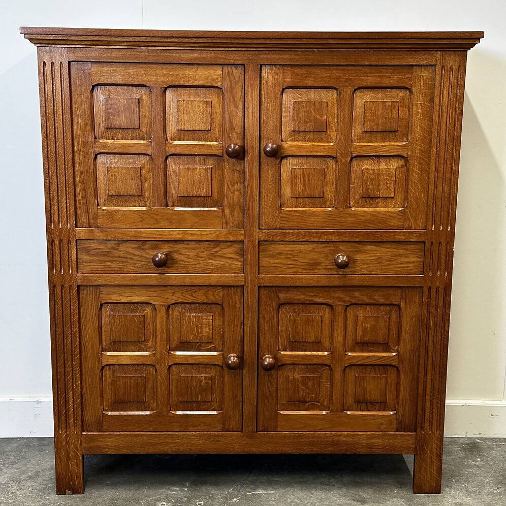 Artisan brutalist oak cabinet with turned knobs, France, 1970s