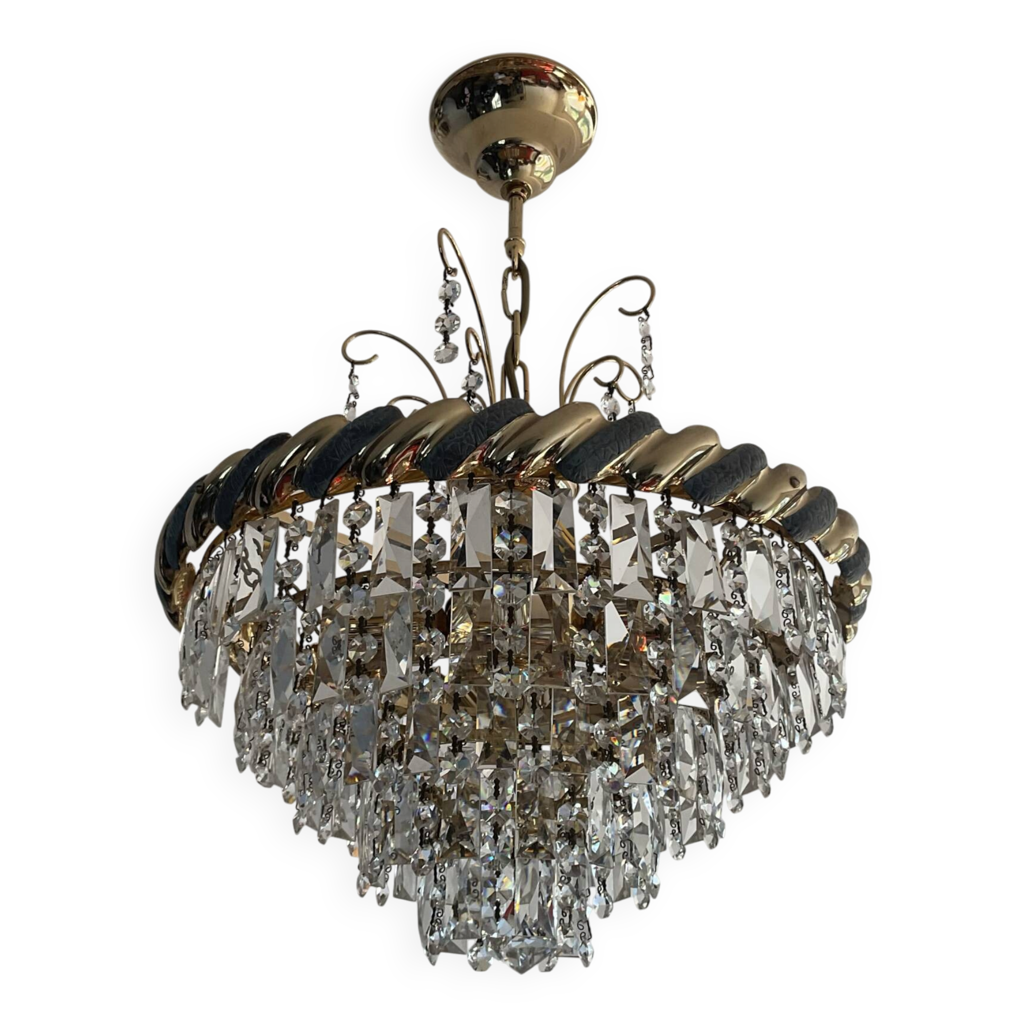Crystal and brass chandelier with a cascade of pendants.
