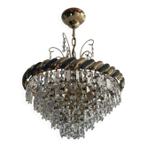 Crystal and brass chandelier with a cascade of pendants.