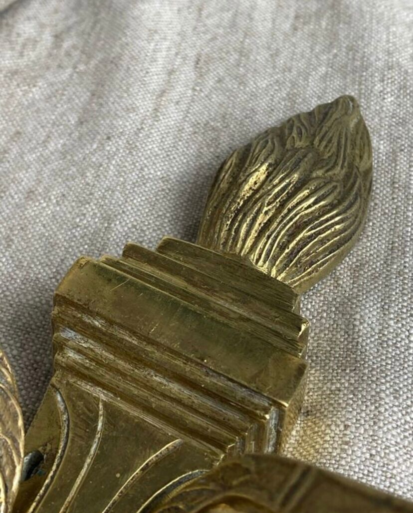 Pair of wall candle holders in bronze