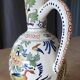 Polychrome earthenware jug, hand-decorated with floral motifs
