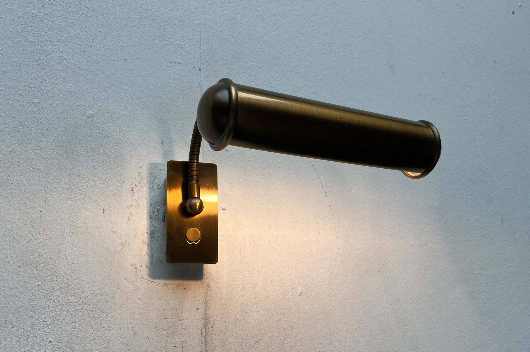 Vintage German brass patinated wall lamp with a gooseneck design by Honsel, 1970s.