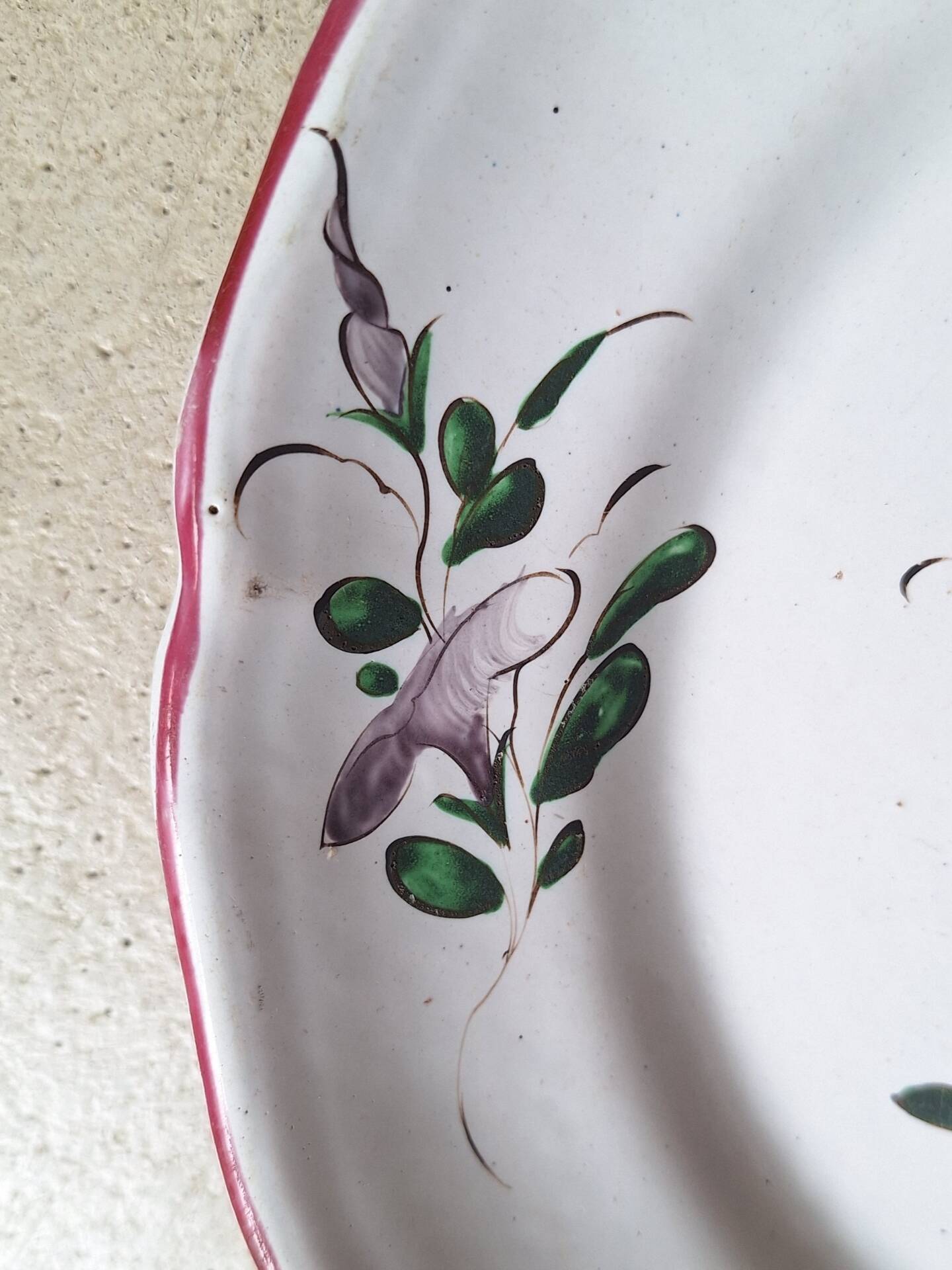 Hand-painted earthenware plate from eastern France, 18th century.