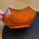 Orange ceramic star-shaped empty bowl