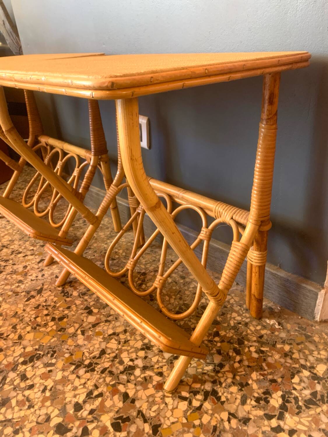 A pair of rattan bedside tables.