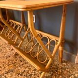 A pair of rattan bedside tables.