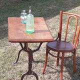 Table de bistrot ancienne dessus bois pieds fonte