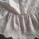 Housse de coussin ronde monogramme brodé