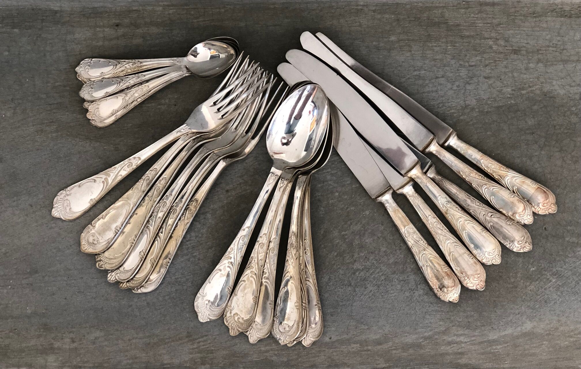 Series of 24 antique silver metal cutlery