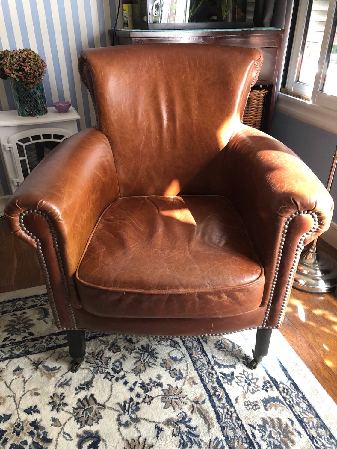 Industrial style aged leather armchair