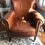 Industrial style aged leather armchair