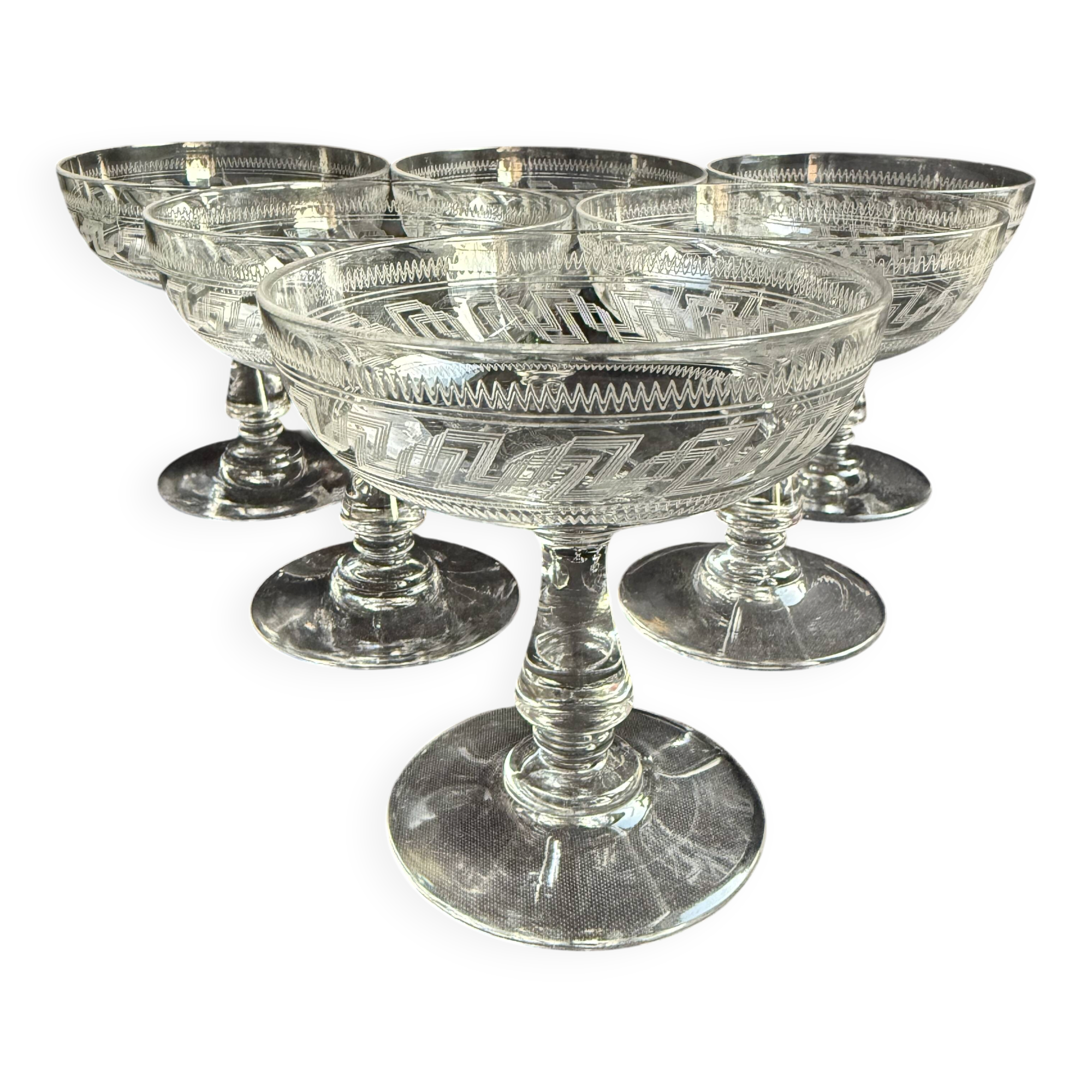 6 Baccarat champagne coupes with Greek engraving, slanted.