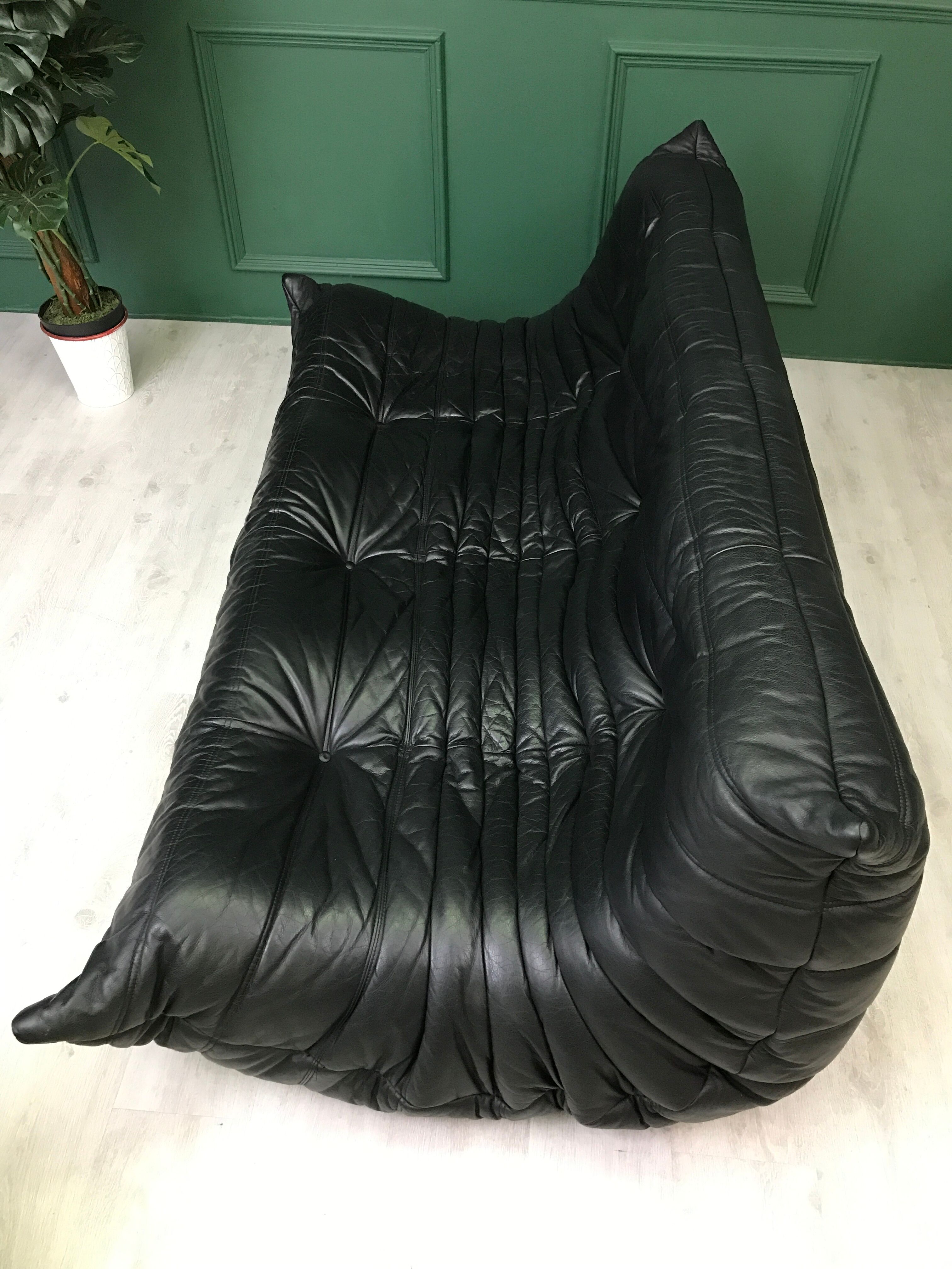 Black leather three seater sofa Togo by Ligne Roset