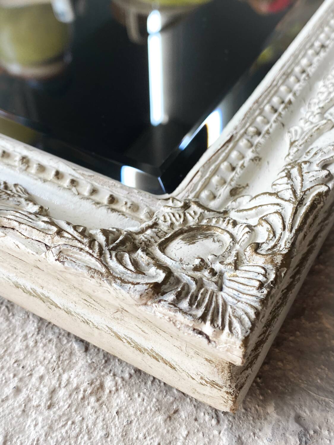 Beveled mirror in carved wood