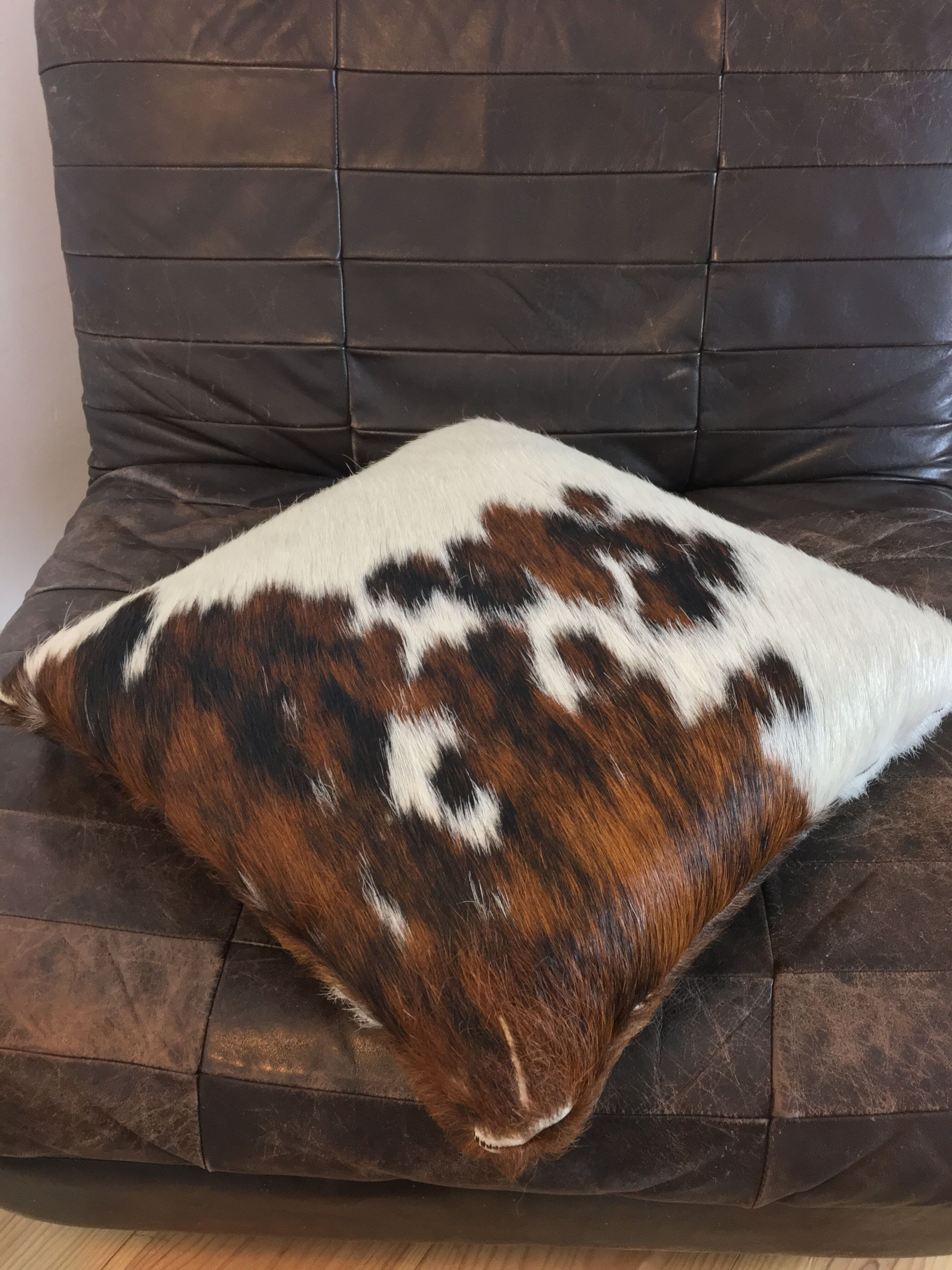 Pouf and cow cushion, leather