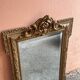 Napoleon-style mirror with a pediment