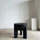 Black mango wood tripod side table with a semi-spherical top, height: 45 cm, diameter: 44 cm.