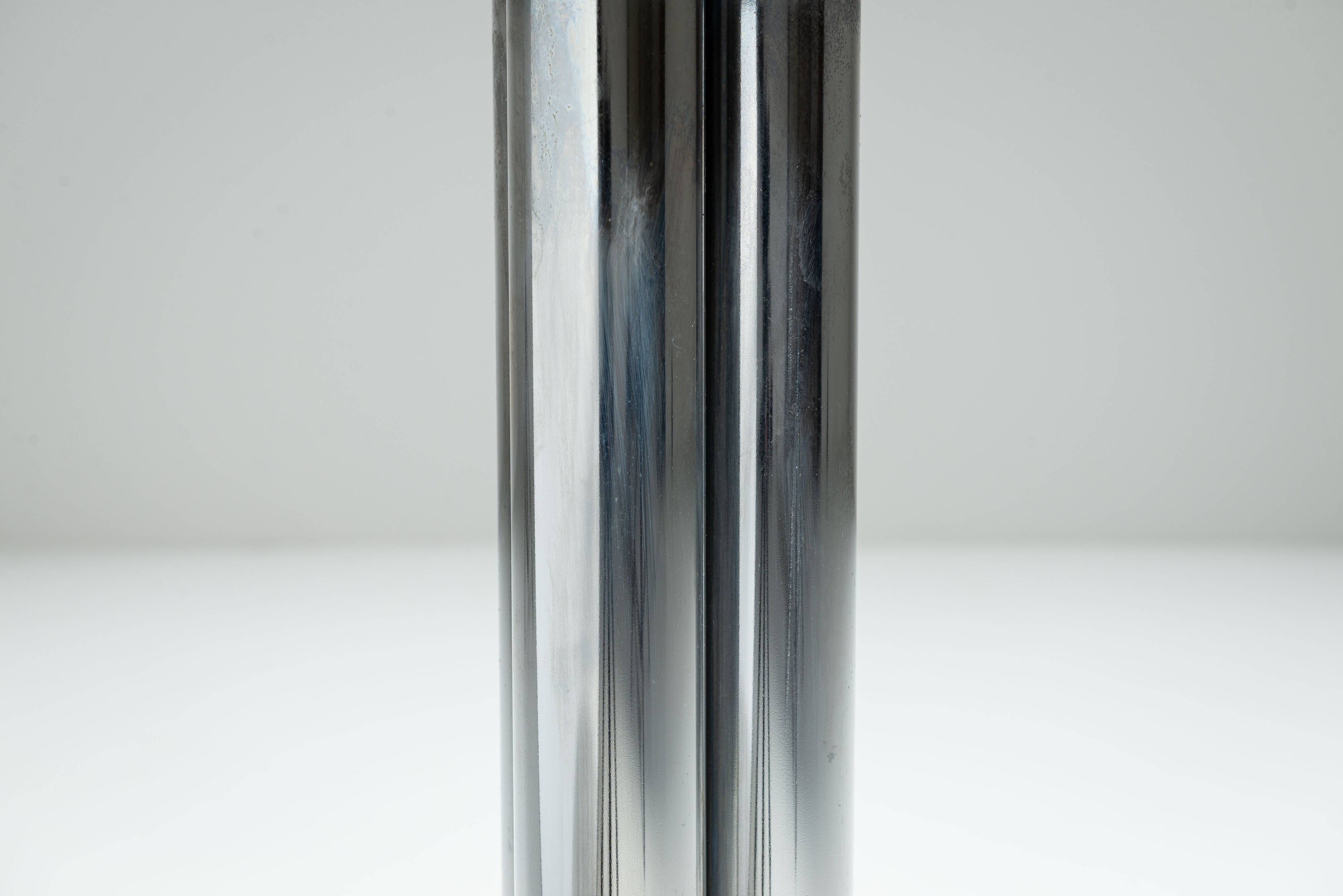 Round sidetable with stone top and three chromed legs