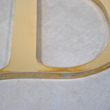 Letter sign in gold metal "D" 1980