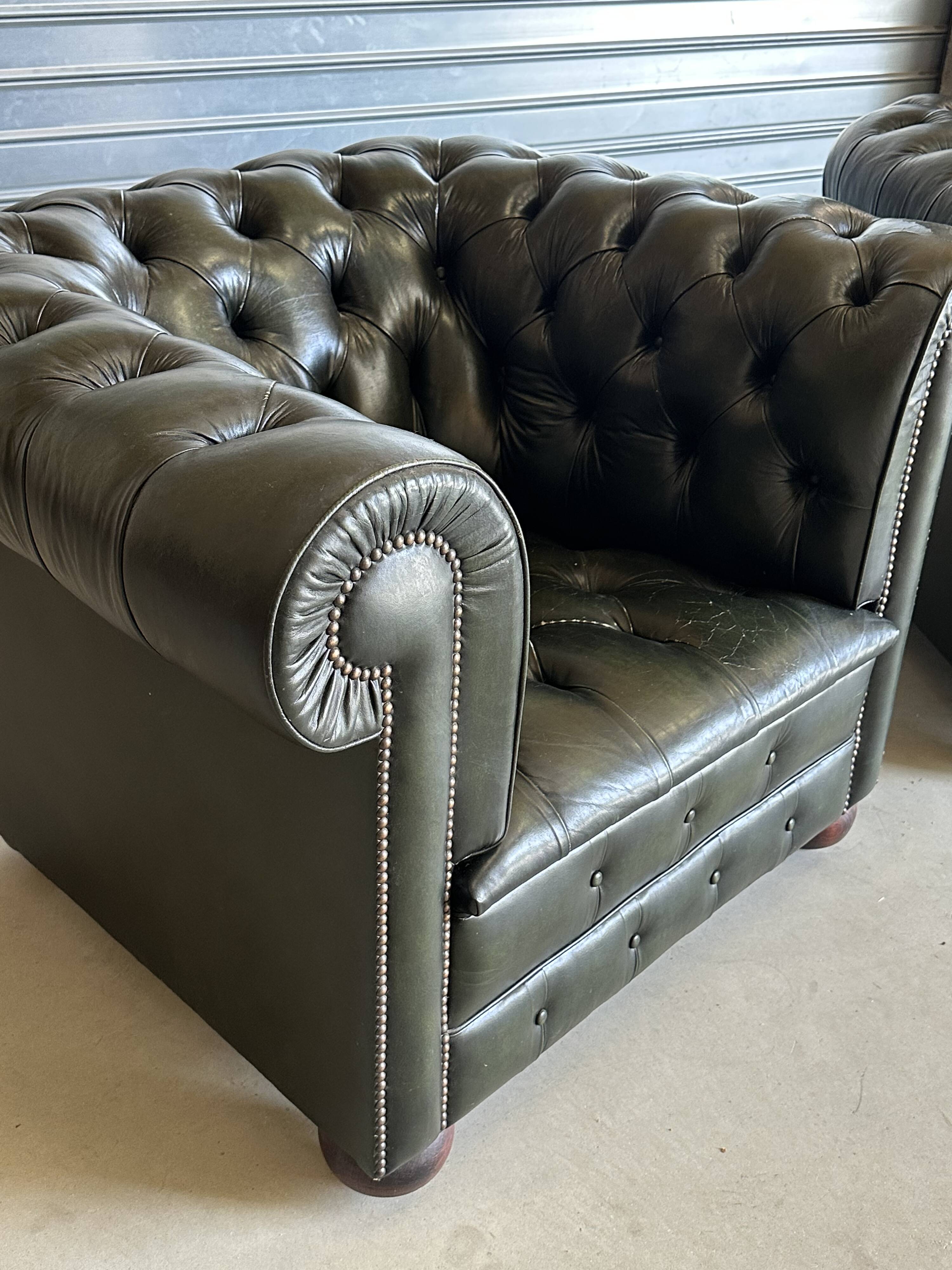 Title: Pair of vintage olive green leather Chesterfield armchairs
