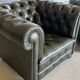 Title: Pair of vintage olive green leather Chesterfield armchairs
