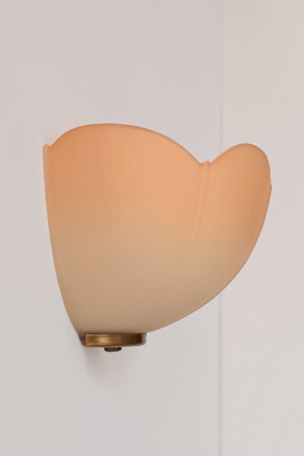 Vintage brass and orange glass wall lights, France 1970.